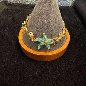 Versace Dua Lipa Gold Starfish Crystal Bracelet with Blue Accents